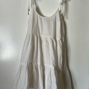 Aerie-  White with Bathing Suit cover with gold on the end of  the tying straps.